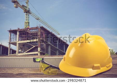 engineer working table plan at building construction site vintage color