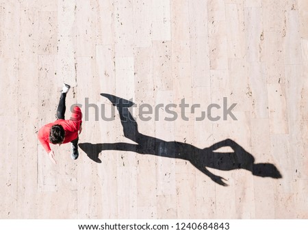 Similar – Image, Stock Photo Top view athlete runner training at road in black sportswear.