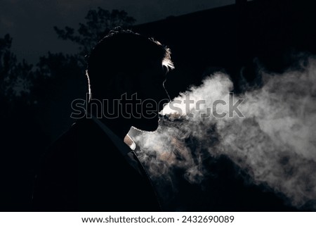 Similar – Image, Stock Photo Young man smoking cigarette in the night