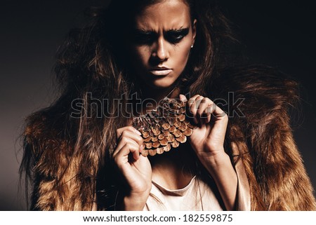 aggressive hot woman in fur coat