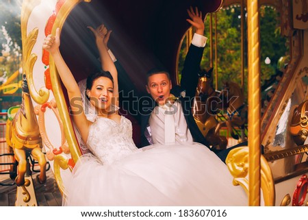 cheerful smiling bride with groom in carriage