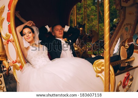 happy married couple in carriage