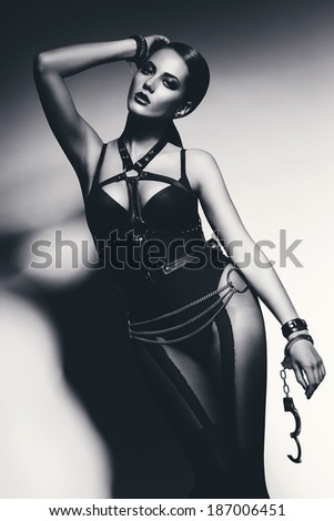 black and white woman with opened handcuffs