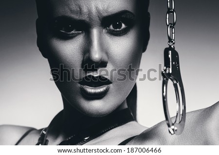 black and white angry woman with handcuffs