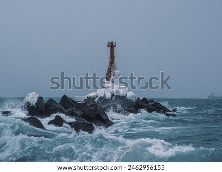 Similar – Foto Bild Einsamer Leuchtturm an felsiger Küste am Morgen