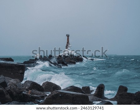 Similar – Foto Bild Einsamer Leuchtturm an felsiger Küste am Morgen