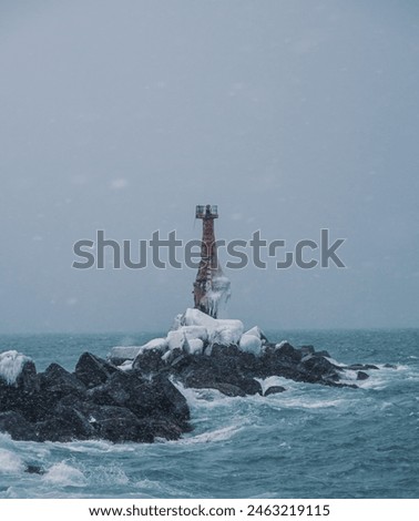 Similar – Foto Bild Einsamer Leuchtturm an felsiger Küste am Morgen