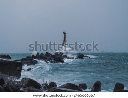 Similar – Foto Bild Einsamer Leuchtturm an felsiger Küste am Morgen