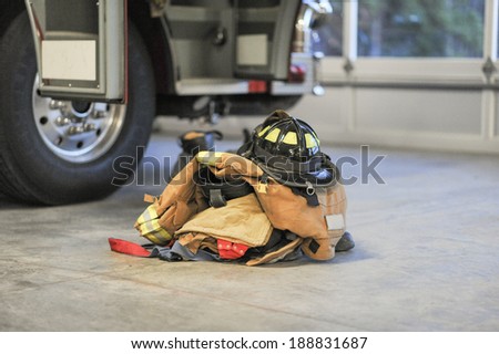 Firefighter turnout / bunker gear ready to go next to fire engine