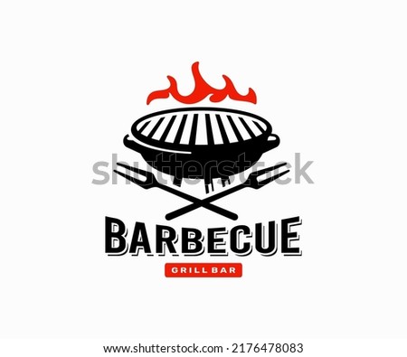 Grill with fire outdoors logo design. Barbecue charcoal grill with carving fork steakhouse restaurant vector design. Cooking over flaming outdoor grill logotype