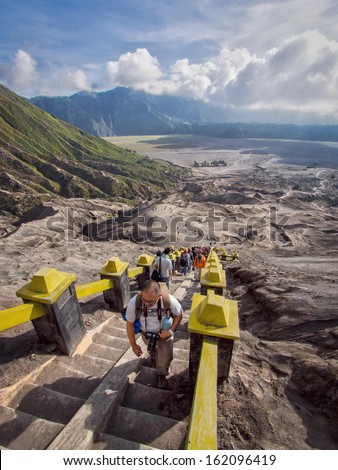 East Java, Indonesia - May 23, 2013: Visitors climbing the stairway leading to the rim of Mount Bromo in Java, Indonesia.