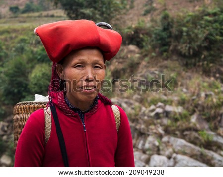 Woman from Red Dao minority group wearing traditional headdress near Ban Ho village, Sapa District, Lao Cai, Vietnam.