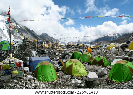 Colorful tents and Tibetan prayer flags at Everest Base Camp, Khumbu Region, Nepal.