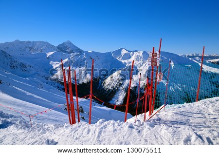 Red ski signs mountains winter snow landscape, High Tatras, Poland