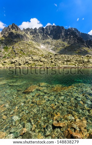 Mountain alpine lake valley stones green clear water summer landscape, 5 lakes valley (Piat Spisskich Ples), High Tatras, Slovakia