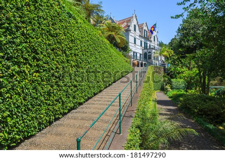 Walkway to colonial style palace in Monte Tropical Gardens, Funchal, Madeira island, Portugal