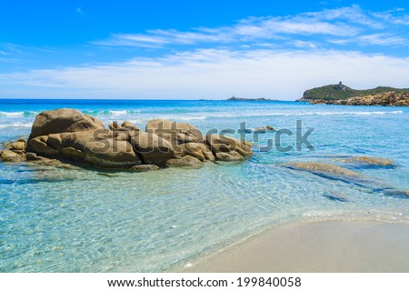 Rocks on Villasimius beach and crystal clear turquoise sea water, Sardinia island, Italy