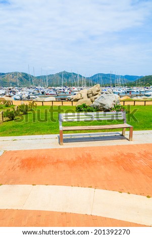 Square with bench in Porto Giunco marina, Sardinia island, Italy