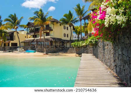 Tropical villa houses on paradise beach in Grand Baie coastal village, Mauritius island