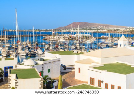 View of marina Rubicon and typical Canary style houses in Playa Blanca town, Lanzarote island, Spain