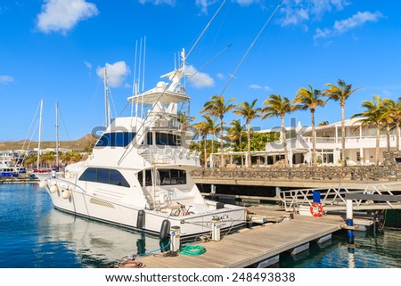 PUERTO CALERO MARINA, LANZAROTE ISLAND - JAN 17, 2015: luxury boat in port built in Caribbean style in Puerto Calero. Canary Islands are popular sailing destination.