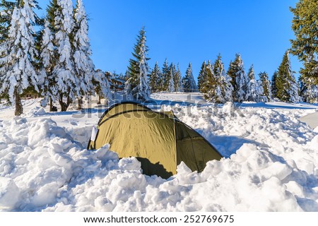 Tent in snow in winter scenery of Gorce Mountains, Poland