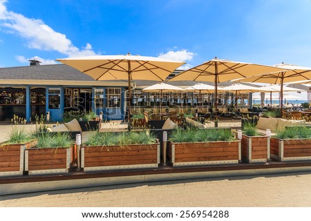 GDYNIA BEACH, POLAND - JUN 10, 2013: View of restaurant outdoor area located on Baltic Sea beach in Gdynia town, Poland. Baltic Sea is very popular tourist destination in Poland.