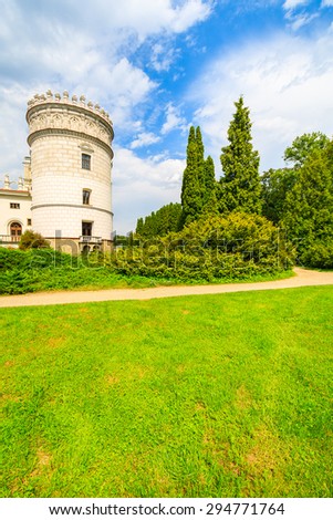 Castle tower in gardens of beautiful Krasiczyn castle on sunny summer day, Poland