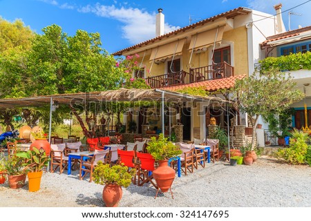 Traditional Greek tavern in small village on coast of Samos island, Greece