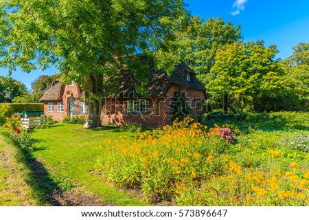 Similar – Foto Bild Rotes Backsteinfriesisches Haus mit Rosenhecke auf der Insel Sylt.