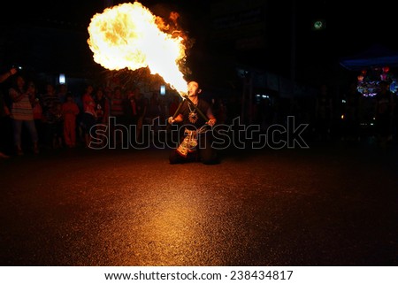 Chiang Mai, Thailand - November 6: fire sword dance, The arts of the ancient Lanna or ancient people of northern Thailand. in the Loy Krathong festivals on November 6, 2014, in Chiang Mai, Thailand.
