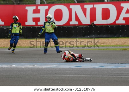 Buriram, Thailand - August 30, 2015: Asia Road Racing Championship 2015. Rescue teams helped a driver who has an accident during the match round 4 in chang international circuit.