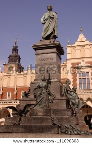 The statue of Adam Mickiewicz in front of the cloth hall in Krakow in Poland