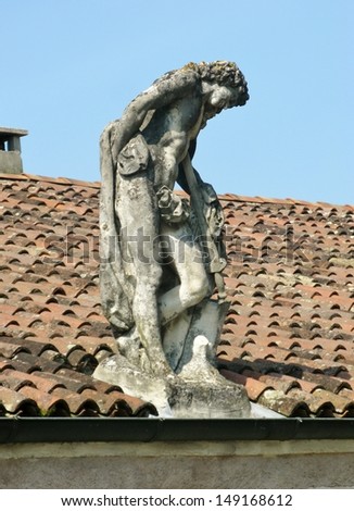 Statue on the roof of a outbuilding of the villa Rotonda near Vicenza in Italy