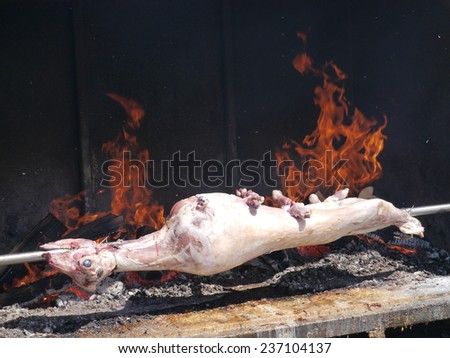A sheep at the spit in an oven with fire of a restaurant in Croatia
