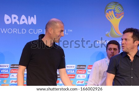 COSTA DO SAUIPE, BRAZIL: DEC 5: Former French soccer player Zinedine Zidane talks with German soccer player Lothar Matthaus at the 2014 World Cup FIFA Draw press conference on December 5, 2013 in Costa do Sauipe, Bahia.