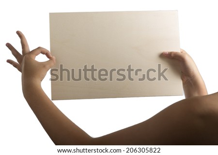 Young caucasian hands holding a light color plywood square blank signboard isolated on white background. All right gesture: left hand making ok.There are no elements to distract viewer from reading
