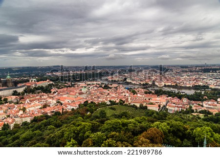 Gloomy day of rain and fog over the red roofs of Prague in the Czech Republic in Central Europe in a view from the tower on Petrin hill.