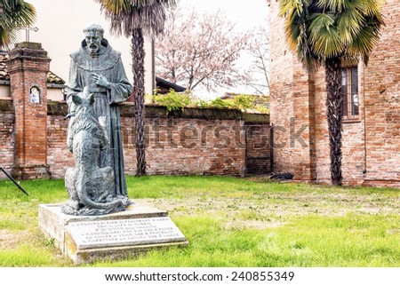 The statue represents the meeting of Saint Francis and the wolf and itÃ?Â¢??s located in the garden at the entry of the XV century roman gothic church dedicated to Saint Francis in Cotignola in Italy