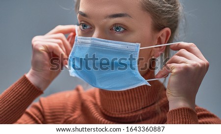 Image, Stock Photo Woman with breathing mask at the window
