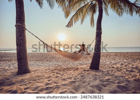 Similar – Image, Stock Photo Woman relaxing in hammock near lake