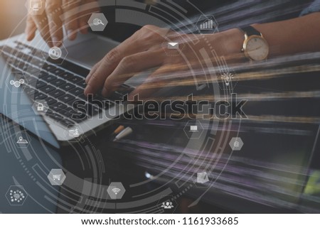 IoT, Internet of Things, Business tecnology, e commerce concept. Man programmer working on laptop computer with modern computer icons interface Foto stock © 
