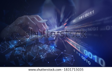 Software development, IoT internet of Things, Internet network technology concept. Man coding programmer, software developer working on digital tablet with binary, html computer code on virtual screen Foto stock © 