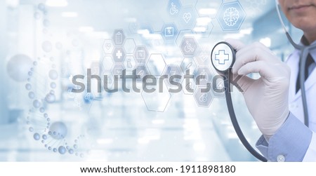 Virtual hospital, telemedicine, medical online, telehealth, healthcare and modern technology concept. Doctor working on digital tablet with medical icons on virtual screen, blurred hospital background