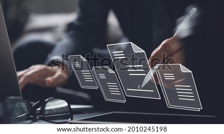 E-signing, electronic signature, document management, paperless office concept. Businessman using stylus pen signing on e document on digital tablet on tablet and virtual notepad on virtual screen