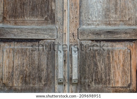 Wooden handles of the old wooden door.