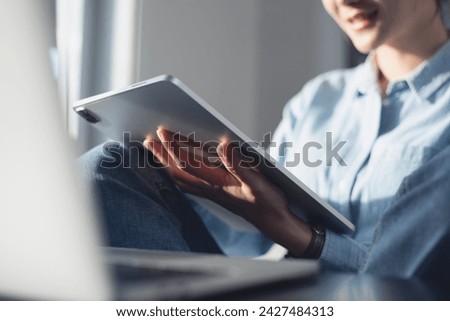 Similar – Image, Stock Photo Relaxed woman using laptop while resting on deck chair