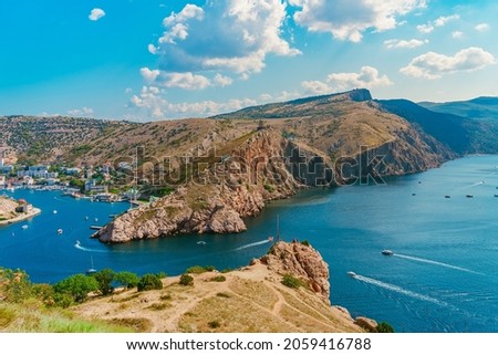 A picturesque panorama of the Balaclava view with yachts and a colorful bay in summer. Postcard view of the tourist Crimea. 商業照片 © 