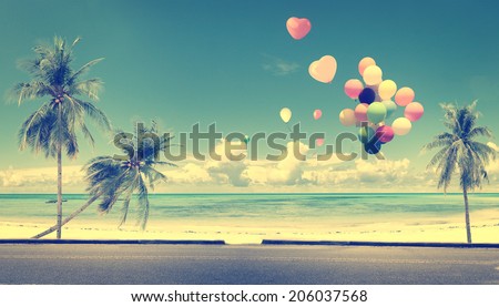 Vintage with heart balloon on beach blue sky concept of love in summer and wedding honeymoon