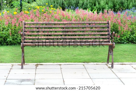 single bench in flower garden
